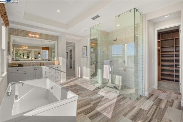 Bathroom, Dual Sink Vanities, Glass Shower, Interior, Recessed Lighting, Wood Texture Flooring