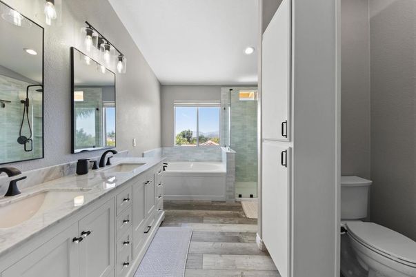 Bathroom, Dual Sink Vanities, Glass Shower, Interior, Recessed Lighting, Wood Texture Flooring