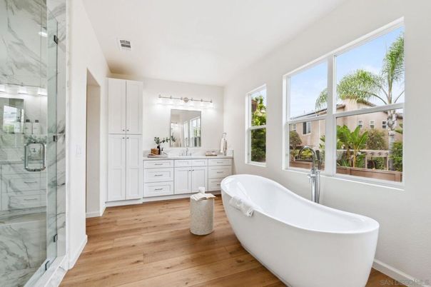 Bathroom, Dual Sink Vanities, Free Standing Baths, Glass Shower, Interior, Marble Walls, Wood Texture Flooring
