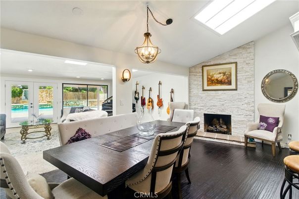 Dining room, Fireplace, Interior, Living room, Pendant Lights, Piano, Recessed Lighting, Stone Walls, Wood Texture Flooring