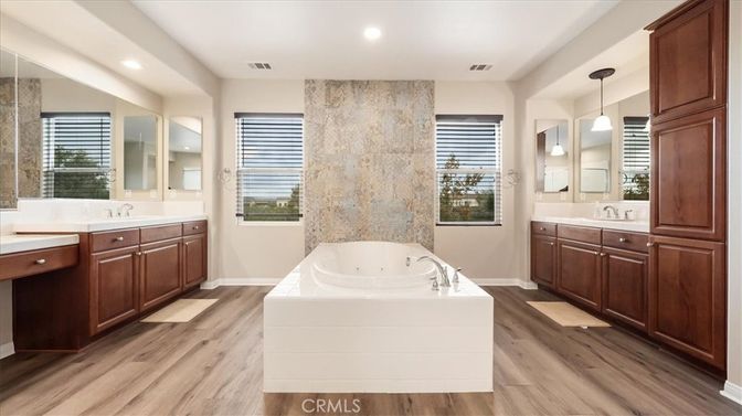 Bathroom, Dual Sink Vanities, Interior, Pendant Lights, Recessed Lighting, Wood Texture Flooring