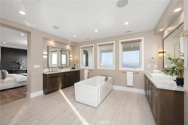 Bathroom, Bedroom, Dual Sink Vanities, Free Standing Baths, Interior, Recessed Lighting, Water, Wood Texture Flooring