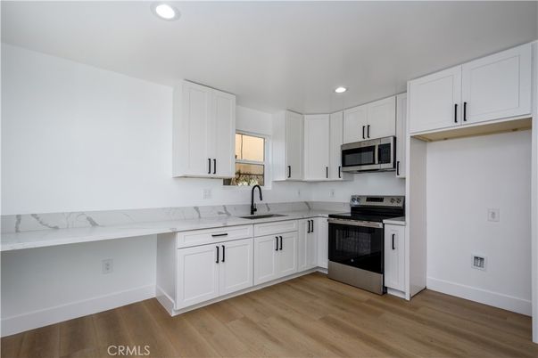 Interior, Kitchen, Recessed Lighting, Stainless Steel Appliances, Wood Texture Flooring