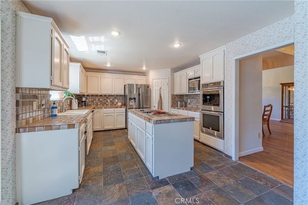Interior, Kitchen, Recessed Lighting, Stainless Steel Appliances, Tile Countertops, Wood Texture Flooring