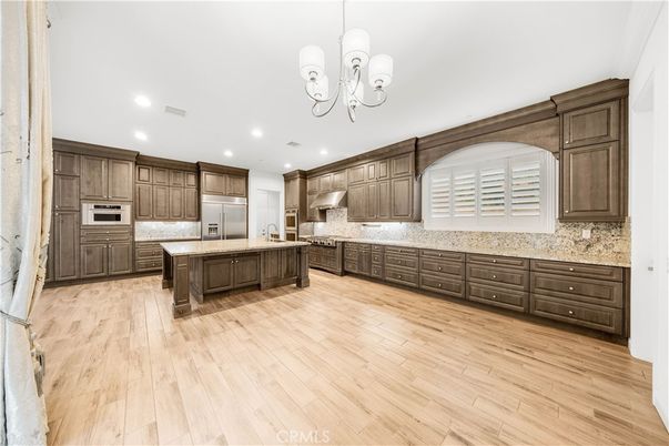 Chandelier, Interior, Kitchen, Recessed Lighting, Stainless Steel Appliances, Wood Texture Flooring