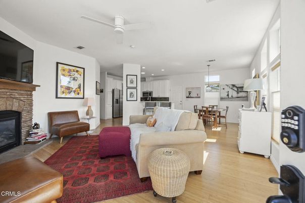 Dining room, Fireplace, Interior, Kitchen, Living room, Pendant Lights, Recessed Lighting, Stainless Steel Appliances, Wood Texture Flooring