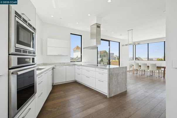 Dining room, Interior, Kitchen, Pendant Lights, Recessed Lighting, Stainless Steel Appliances, Wood Texture Flooring