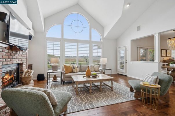 Chandelier, Fireplace, Interior, Living room, Recessed Lighting, Stone Walls, Wood Texture Flooring