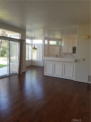 Empty room, Interior, Kitchen, Pendant Lights, Tile Countertops, Wood Texture Flooring