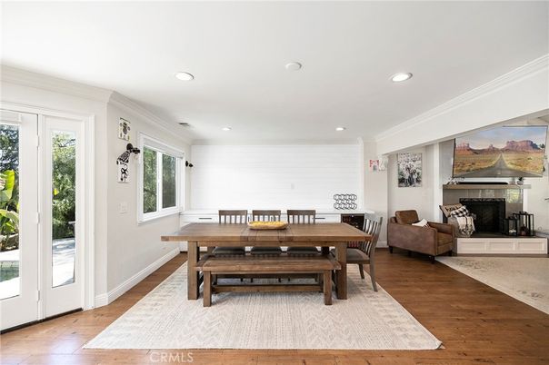 Dining room, Fireplace, Interior, Living room, Recessed Lighting, Wood Texture Flooring