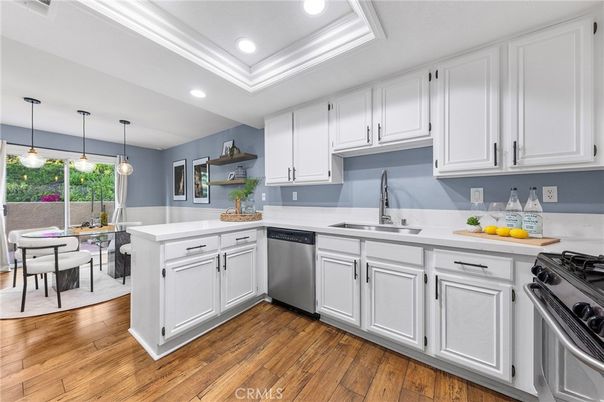 Dining room, Interior, Kitchen, Pendant Lights, Recessed Lighting, Stainless Steel Appliances, Wood Texture Flooring