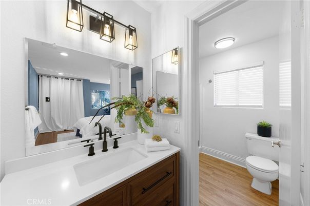 Bathroom, Dual Sink Vanities, Interior, Recessed Lighting, Wood Texture Flooring