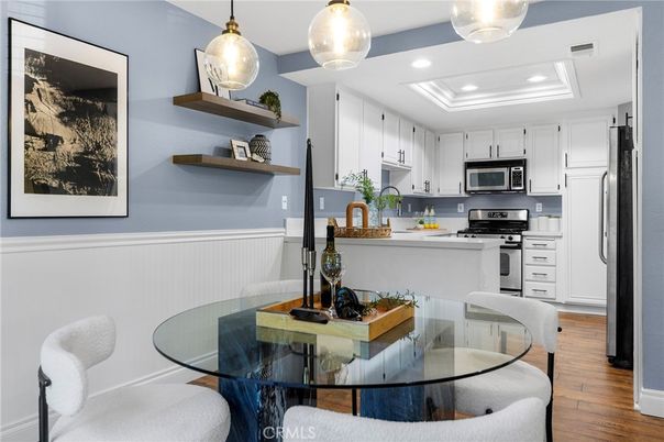Dining room, Interior, Kitchen, Pendant Lights, Recessed Lighting, Stainless Steel Appliances, Wood Texture Flooring
