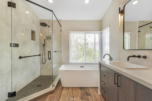 Bathroom, Free Standing Baths, Glass Shower, Interior, Recessed Lighting, Wood Texture Flooring