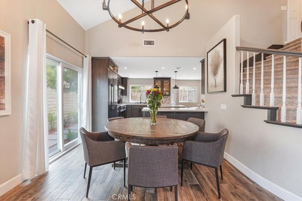 Chandelier, Dining room, Interior, Kitchen, Pendant Lights, Recessed Lighting, Stainless Steel Appliances, Wood Texture Flooring