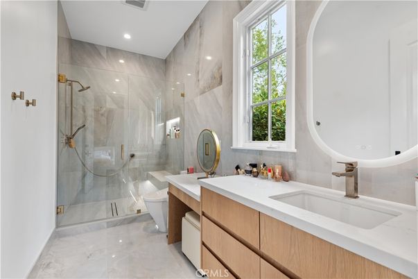 Bathroom, Dual Sink Vanities, Glass Shower, Interior, Marble, Marble Walls, Recessed Lighting