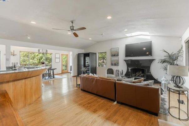 Dining room, Fireplace, Interior, Living room, Recessed Lighting, Wood Texture Flooring