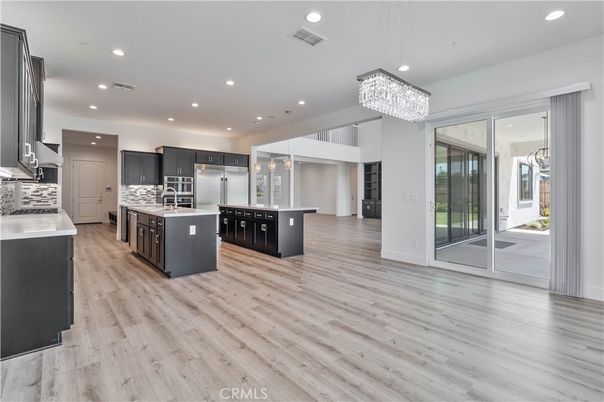 Chandelier, Interior, Kitchen, Pendant Lights, Recessed Lighting, Stainless Steel Appliances, Wood Texture Flooring
