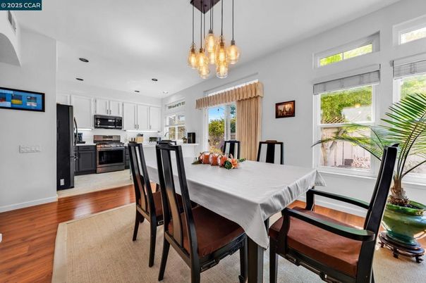 Dining room, Interior, Kitchen, Pendant Lights, Recessed Lighting, Stainless Steel Appliances, Wood Texture Flooring