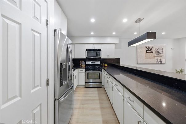 Interior, Kitchen, Pendant Lights, Recessed Lighting, Stainless Steel Appliances, Wood Texture Flooring