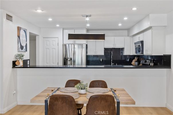 Dining room, Interior, Kitchen, Recessed Lighting, Stainless Steel Appliances, Wood Texture Flooring