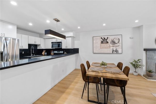 Dining room, Interior, Kitchen, Pendant Lights, Recessed Lighting, Stainless Steel Appliances, Wood Texture Flooring
