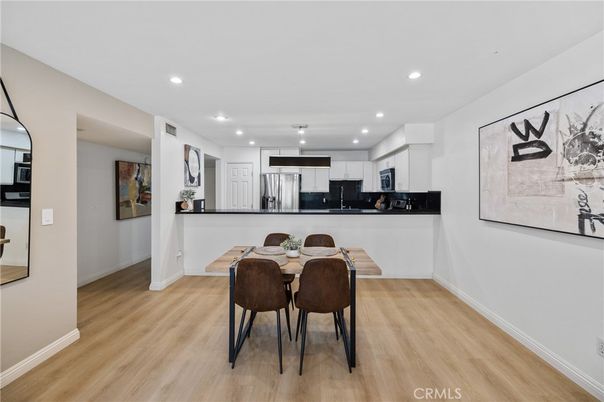 Dining room, Interior, Kitchen, Pendant Lights, Recessed Lighting, Stainless Steel Appliances, Wood Texture Flooring