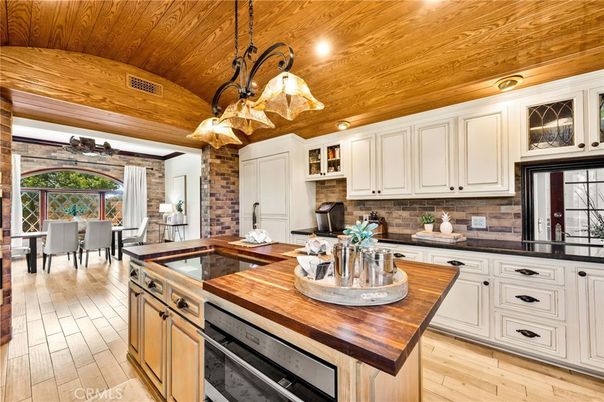 Chandelier, Dining room, Interior, Kitchen, Pendant Lights, Recessed Lighting, Wooden Ceilings, Wood Texture Flooring