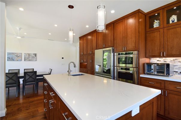 Dining room, Interior, Kitchen, Pendant Lights, Recessed Lighting, Stainless Steel Appliances, Wood Texture Flooring