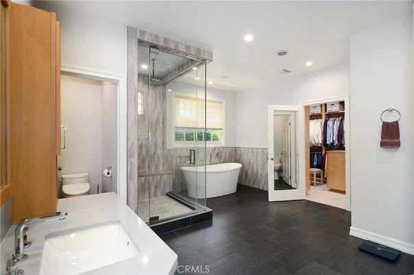 Bathroom, Dual Sink Vanities, Free Standing Baths, Glass Shower, Interior, Marble Walls, Recessed Lighting