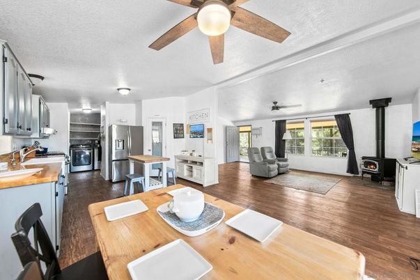 Dining room, Fireplace, Interior, Kitchen, Living room, Stainless Steel Appliances, Wood Texture Flooring
