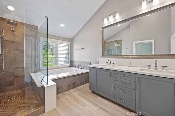 Bathroom, Dual Sink Vanities, Glass Shower, Interior, Recessed Lighting, Wood Texture Flooring