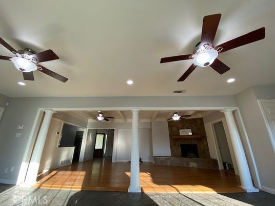 Empty room, Fireplace, Interior, Recessed Lighting, Stone Walls, Wood Texture Flooring