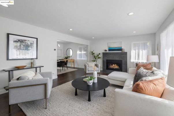 Dining room, Fireplace, Interior, Living room, Recessed Lighting, Wood Texture Flooring