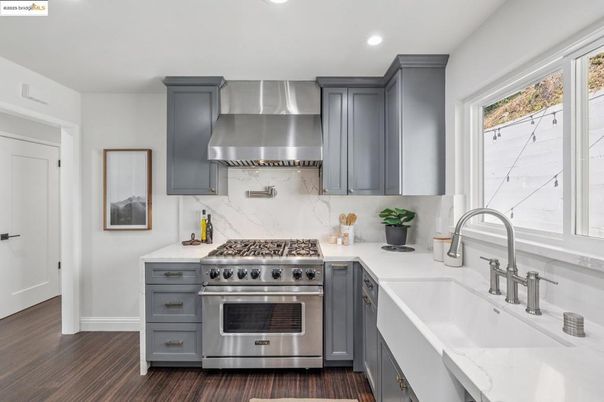 Interior, Kitchen, Marble Walls, Recessed Lighting, Stainless Steel Appliances, Wood Texture Flooring