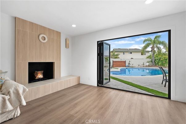 Fireplace, Interior, Pool, Recessed Lighting, Wood Texture Flooring