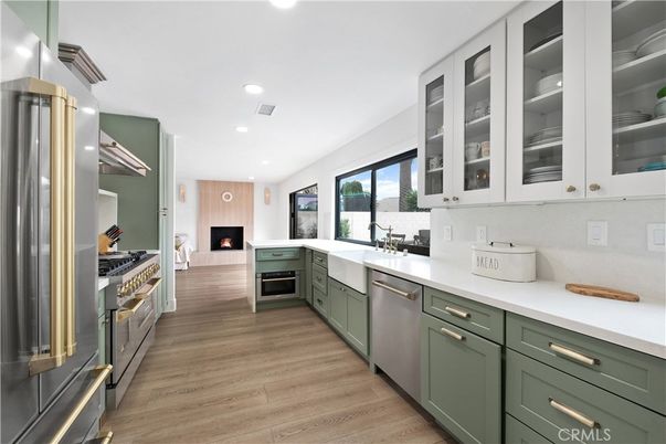 Fireplace, Interior, Kitchen, Recessed Lighting, Stainless Steel Appliances, Wood Texture Flooring