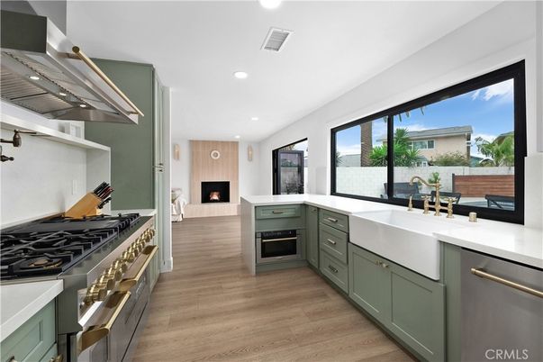 Fireplace, Interior, Kitchen, Recessed Lighting, Stainless Steel Appliances, Wood Texture Flooring