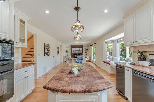 Dining room, Fireplace, Interior, Kitchen, Pendant Lights, Recessed Lighting, Stainless Steel Appliances, Wood Texture Flooring