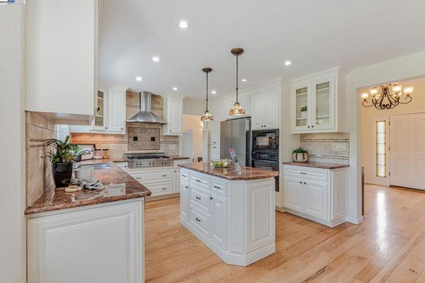 Chandelier, Interior, Kitchen, Pendant Lights, Recessed Lighting, Stainless Steel Appliances, Wood Texture Flooring