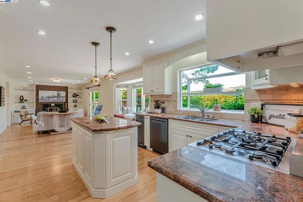 Dining room, Fireplace, Interior, Kitchen, Living room, Pendant Lights, Recessed Lighting, Stainless Steel Appliances, Wood Texture Flooring