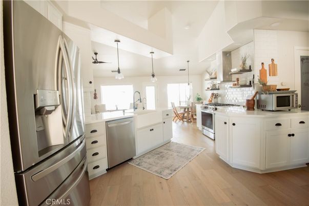 Dining room, Interior, Kitchen, Pendant Lights, Stainless Steel Appliances, Wood Texture Flooring