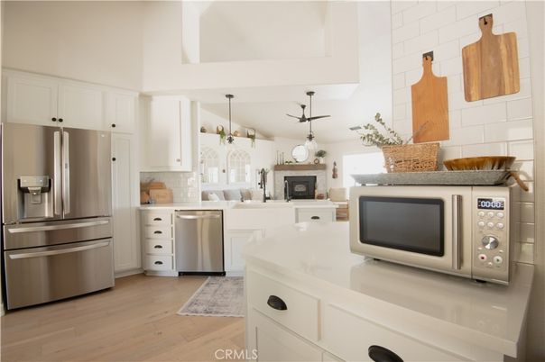 Fireplace, Interior, Kitchen, Pendant Lights, Stainless Steel Appliances, Wood Texture Flooring