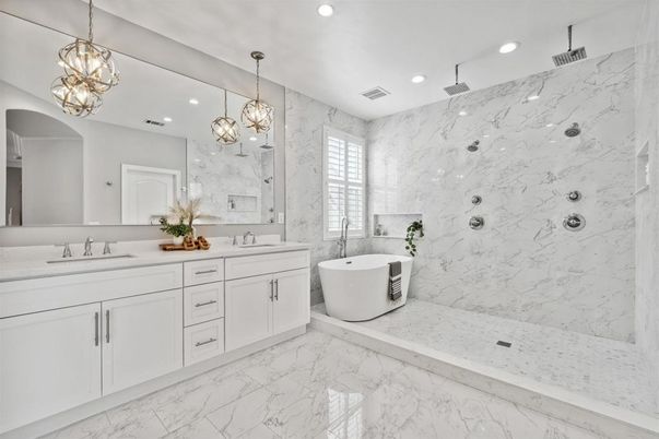Bathroom, Dual Sink Vanities, Free Standing Baths, Interior, Marble, Marble Walls, Pendant Lights, Recessed Lighting