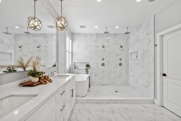 Bathroom, Dual Sink Vanities, Free Standing Baths, Interior, Marble, Marble Walls, Pendant Lights, Recessed Lighting