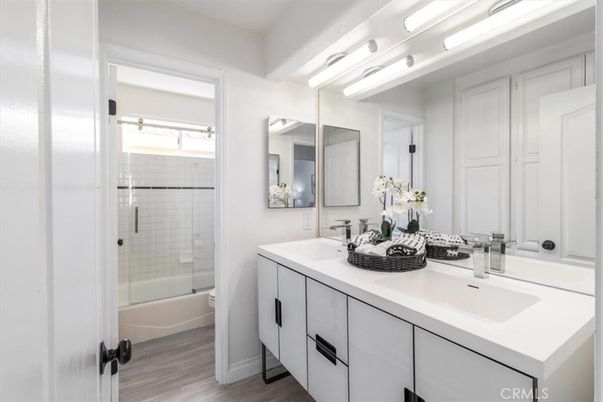 Bathroom, Dual Sink Vanities, Glass Shower, Interior, Wood Texture Flooring