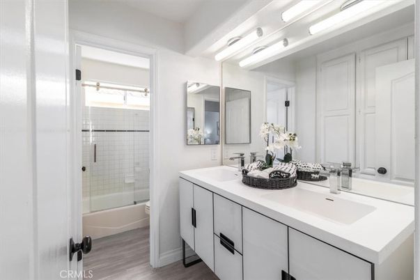 Bathroom, Dual Sink Vanities, Glass Shower, Interior, Wood Texture Flooring