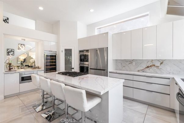Interior, Kitchen, Marble Walls, Recessed Lighting, Stainless Steel Appliances