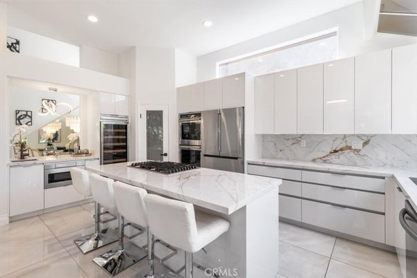 Interior, Kitchen, Marble Walls, Recessed Lighting, Stainless Steel Appliances