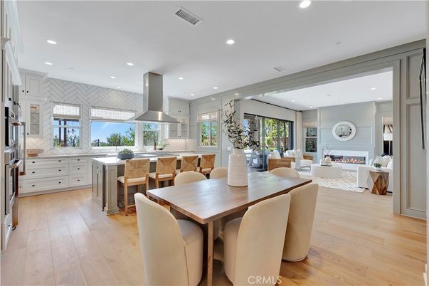Dining room, Fireplace, Interior, Kitchen, Living room, Recessed Lighting, Stainless Steel Appliances, Wood Texture Flooring